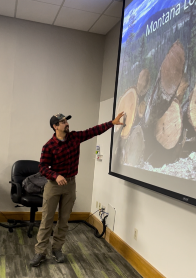 Image of Zack doing a presentation for his forestry class.