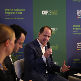 Image of Russell Hagen responding to a question during a panel discussion during COP28.