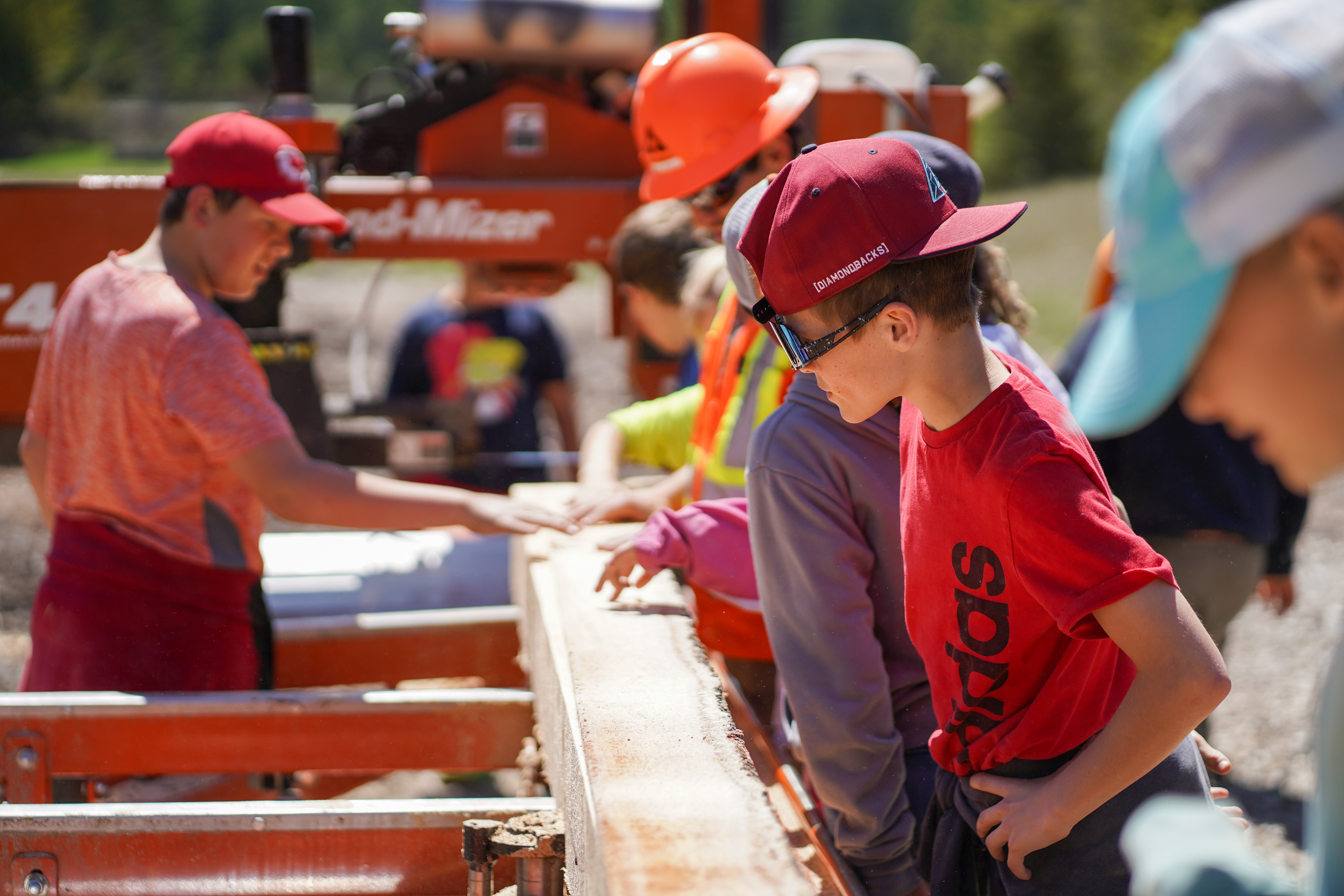 Image of students working on the portable sawmill at the Family Forestry Expo.