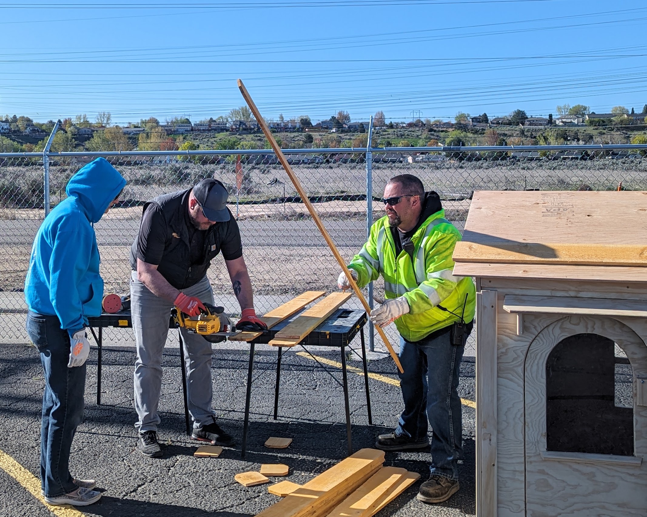 Image of Boise Distribution employees during the project to build a playhouse for a local family.