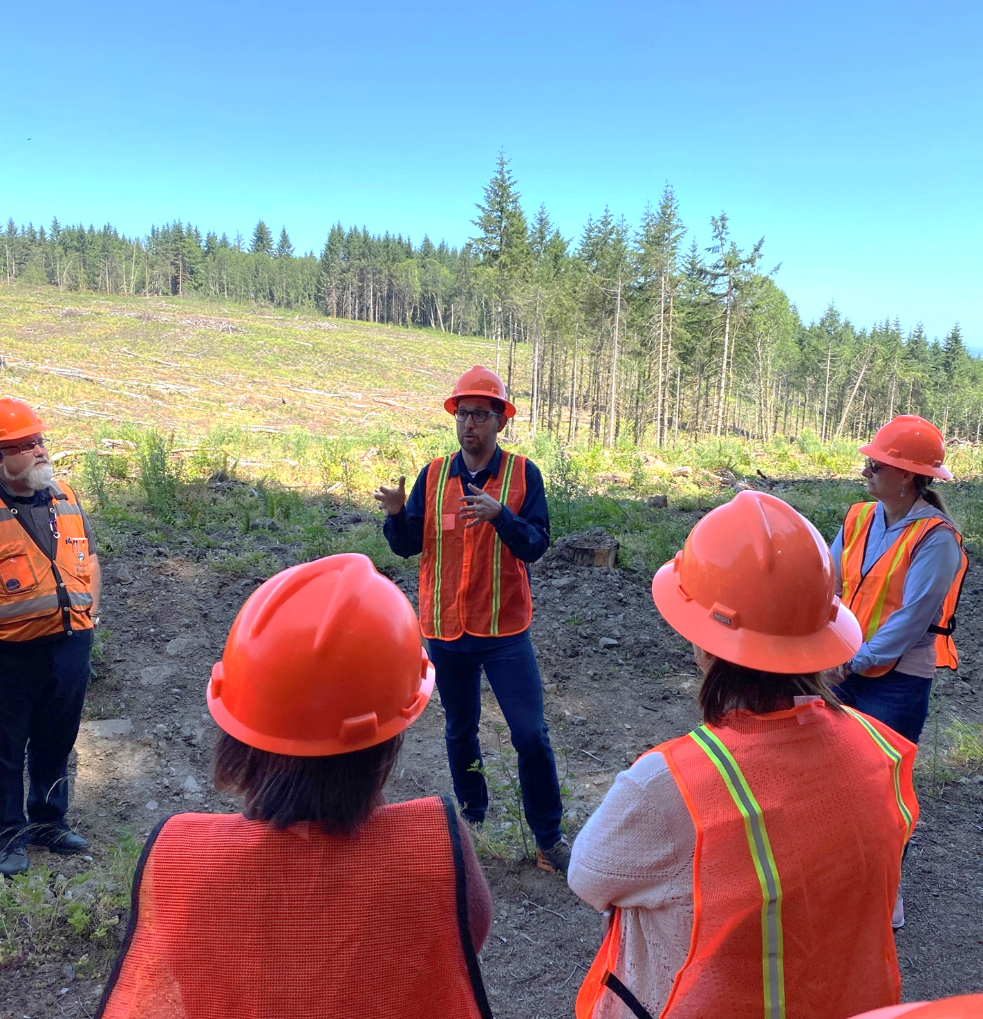 Image of Vaughan Andrews, senior program manager of Sustainability, responding to a question during the tour of the Vail tree farm.