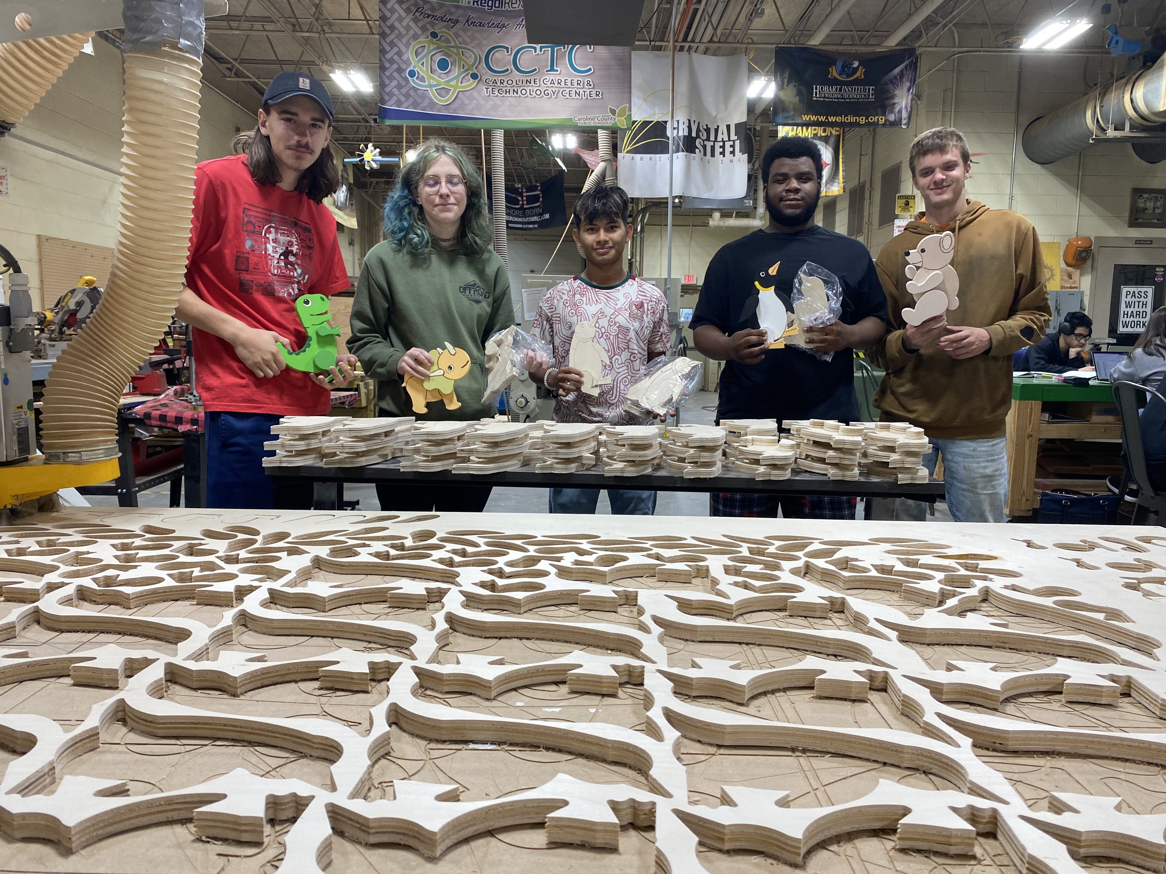 Image of students showing off the assembled models.