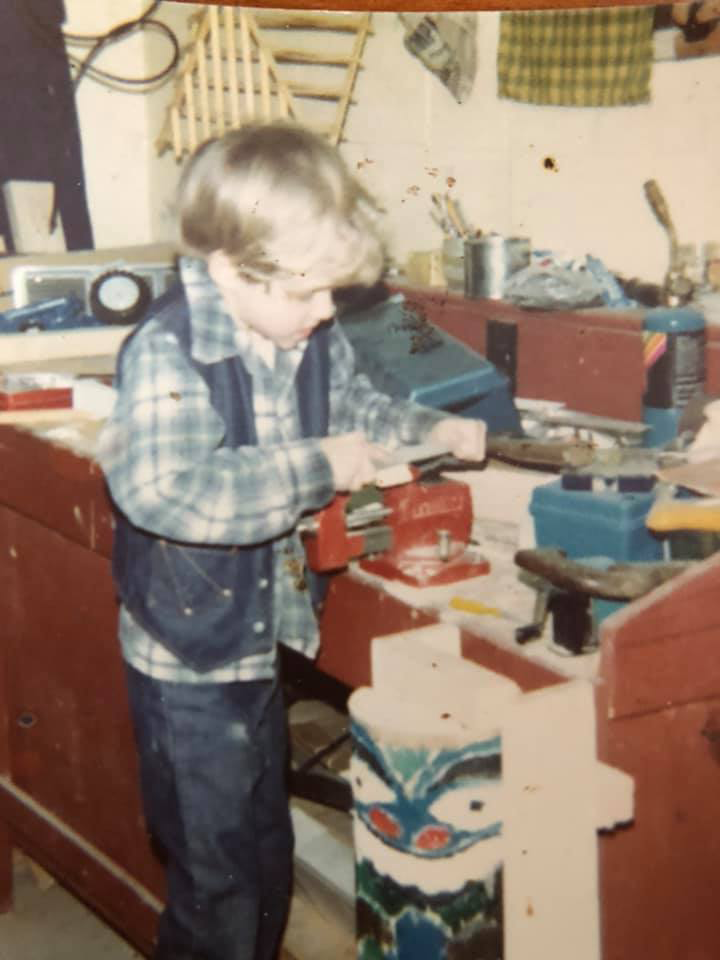 Image of Steve Mead woodworking as a child.