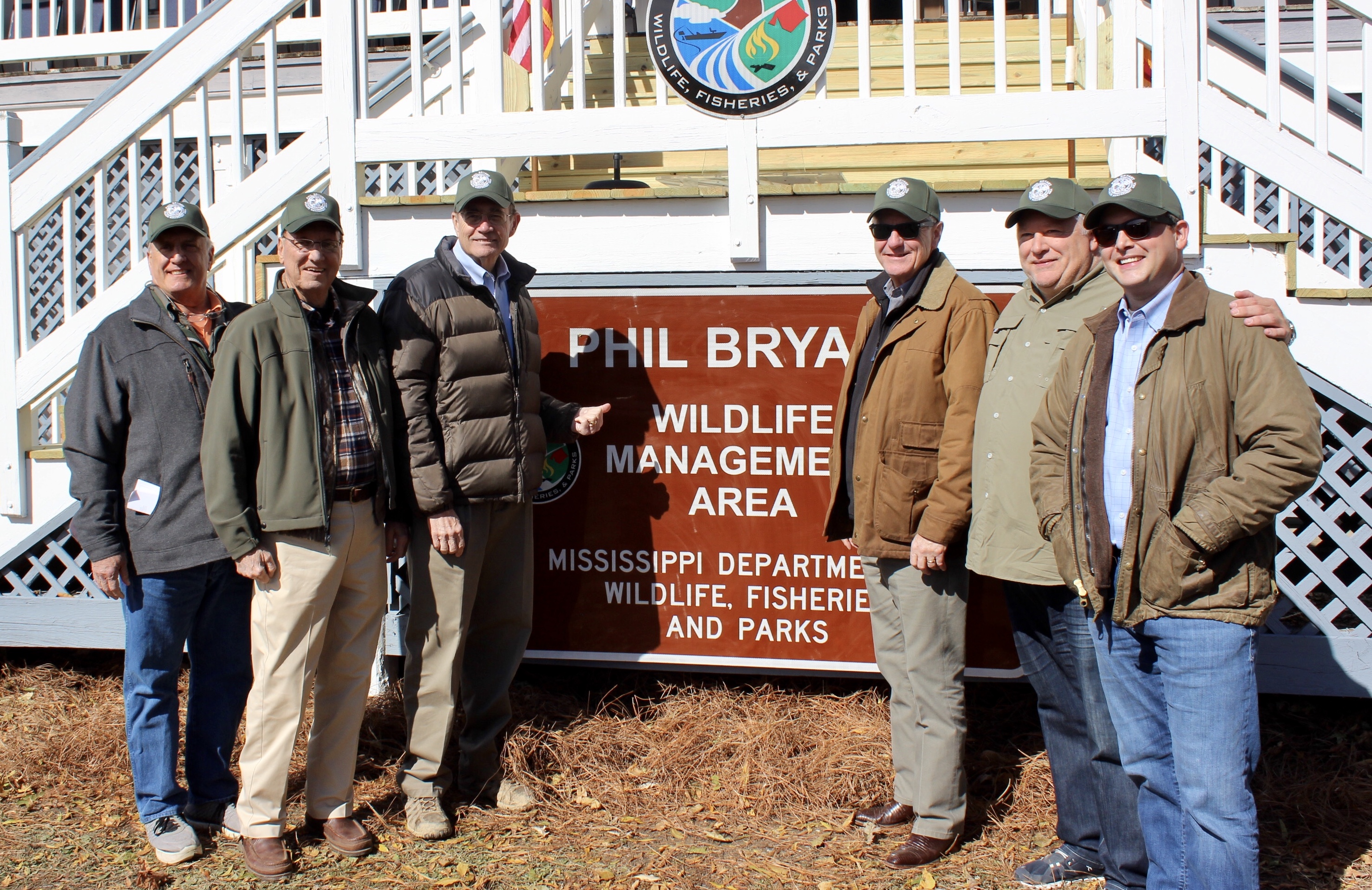 Image of Alex celebrating the announcement of a new wildlife management area in Mississippi with colleagues.