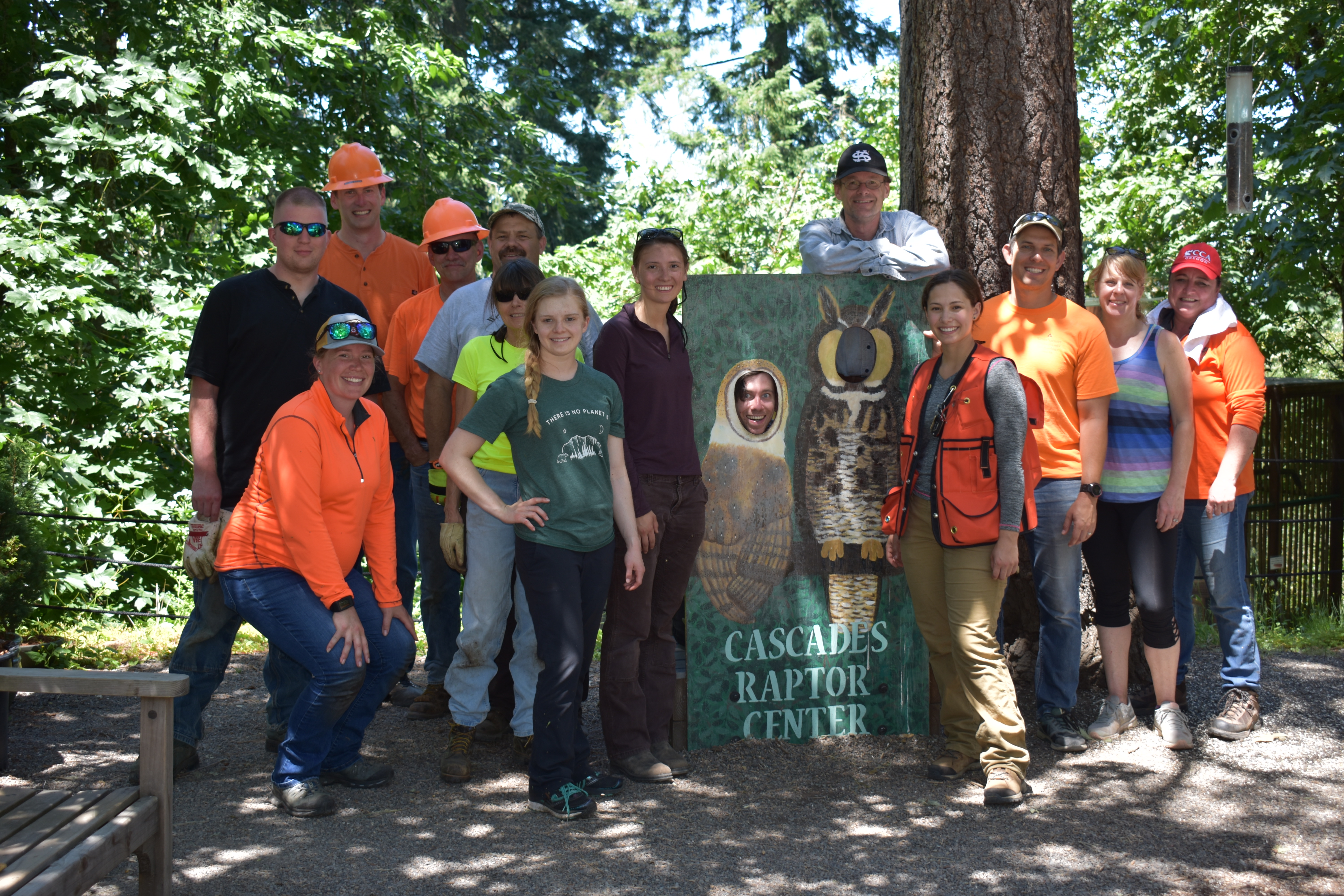 Image of Matt and a group of Weyerhaeuser volunteers participating in a clean-up event at the Cascades Raptor Center.
