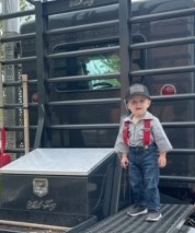 Image of a child dressed up as a trucker.