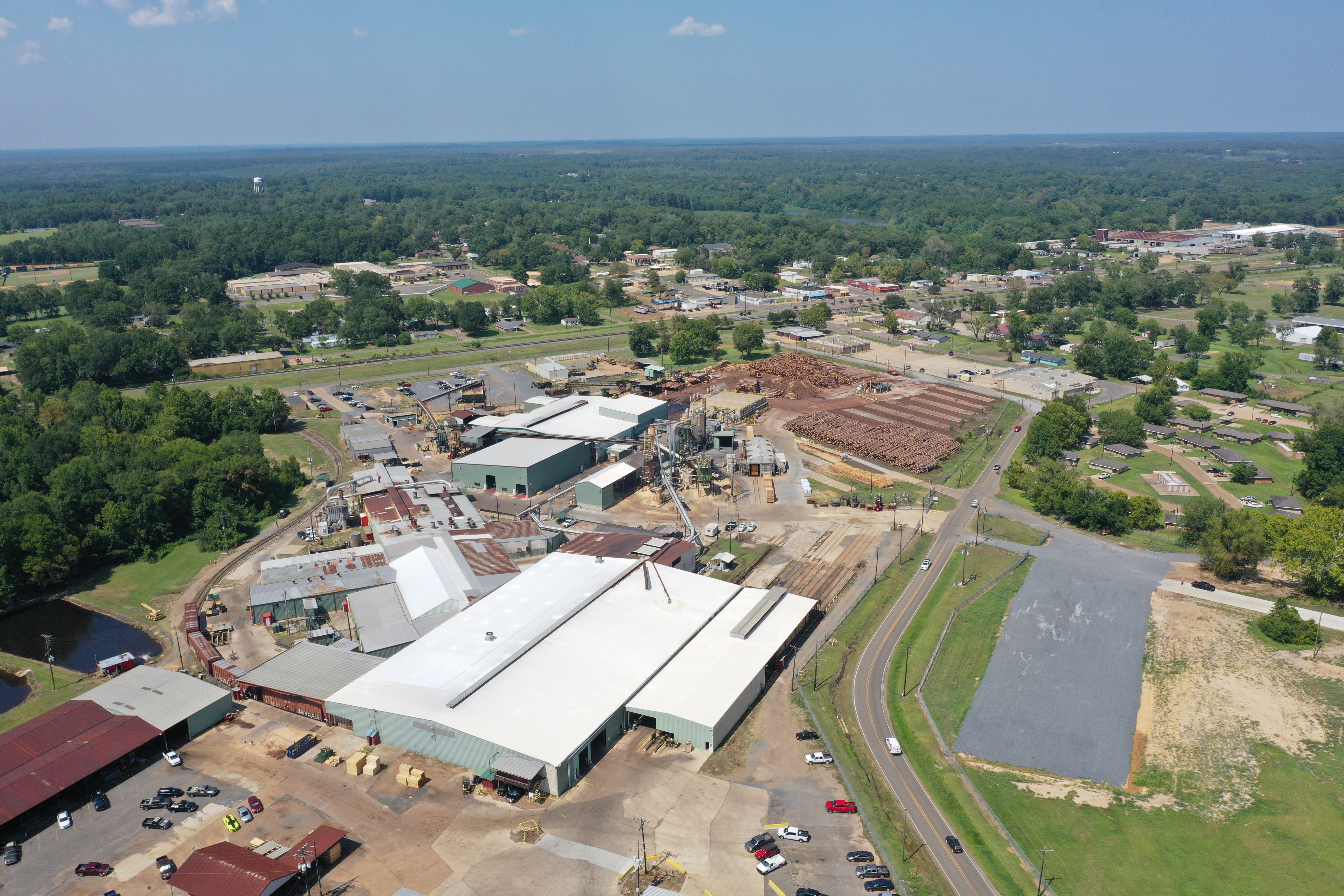 Another arial view of the Zwolle plant with the buildings in the foreground and the log yard in the distance.